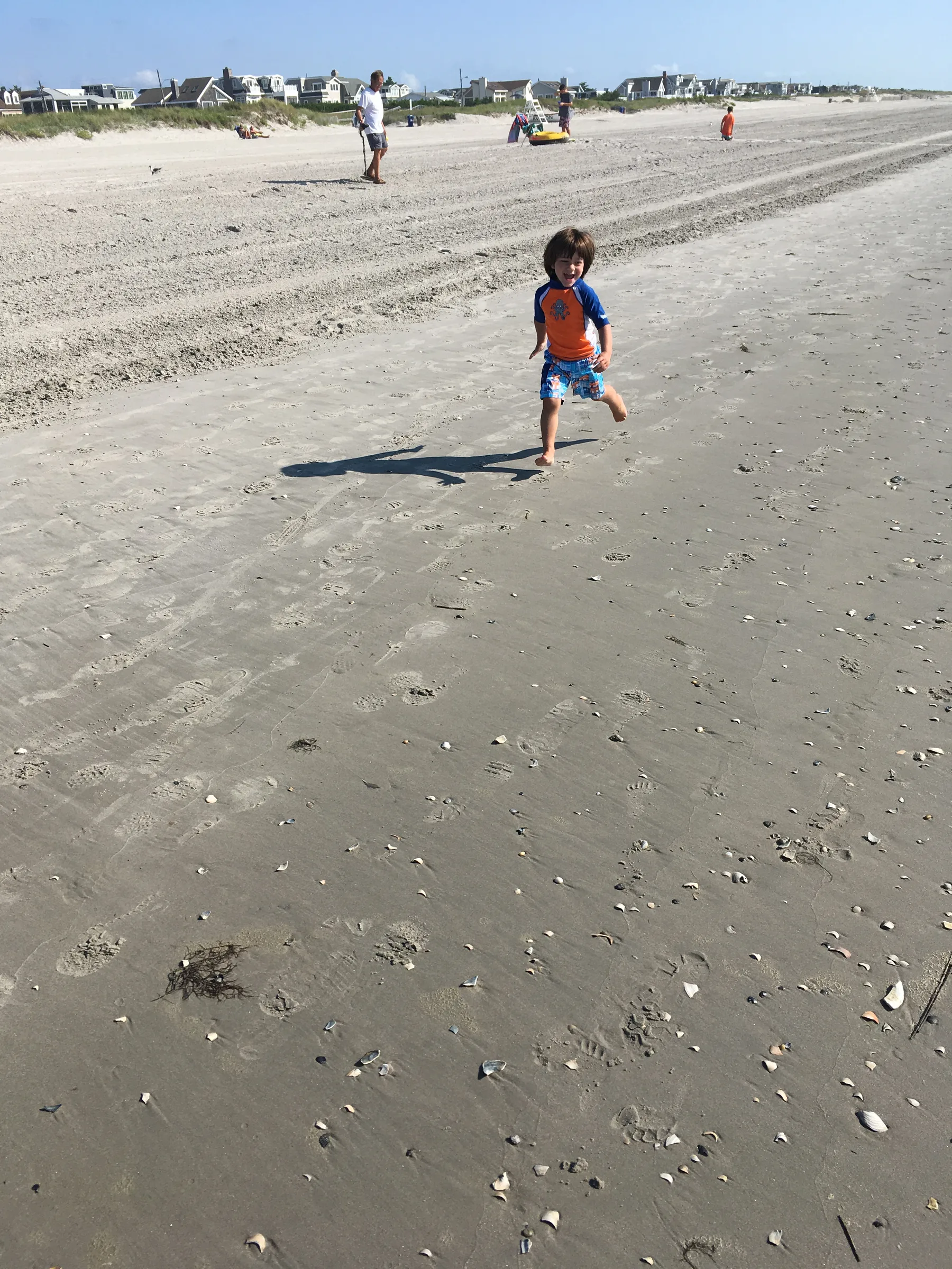 A child running on the beach, from Kim Baggio's family health journey